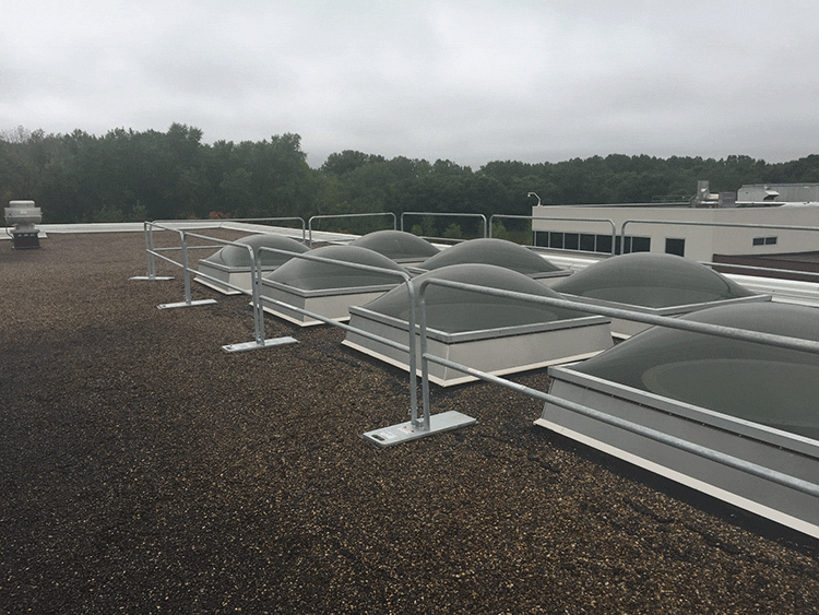 Steel guardrail system for rooftop safety skylights