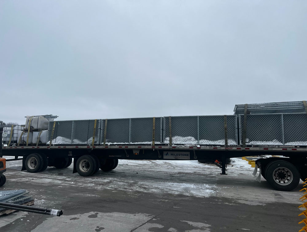 transporting barrier fence system into New York