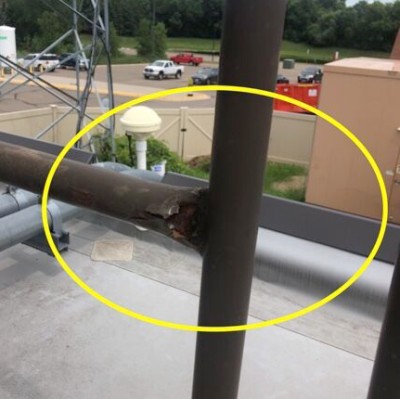 1654365944840 pinched safety rail showing rusting and failure points